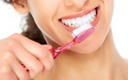Close-up-of-woman-brushing-strong-healthy-looking-teeth-e1461883766592